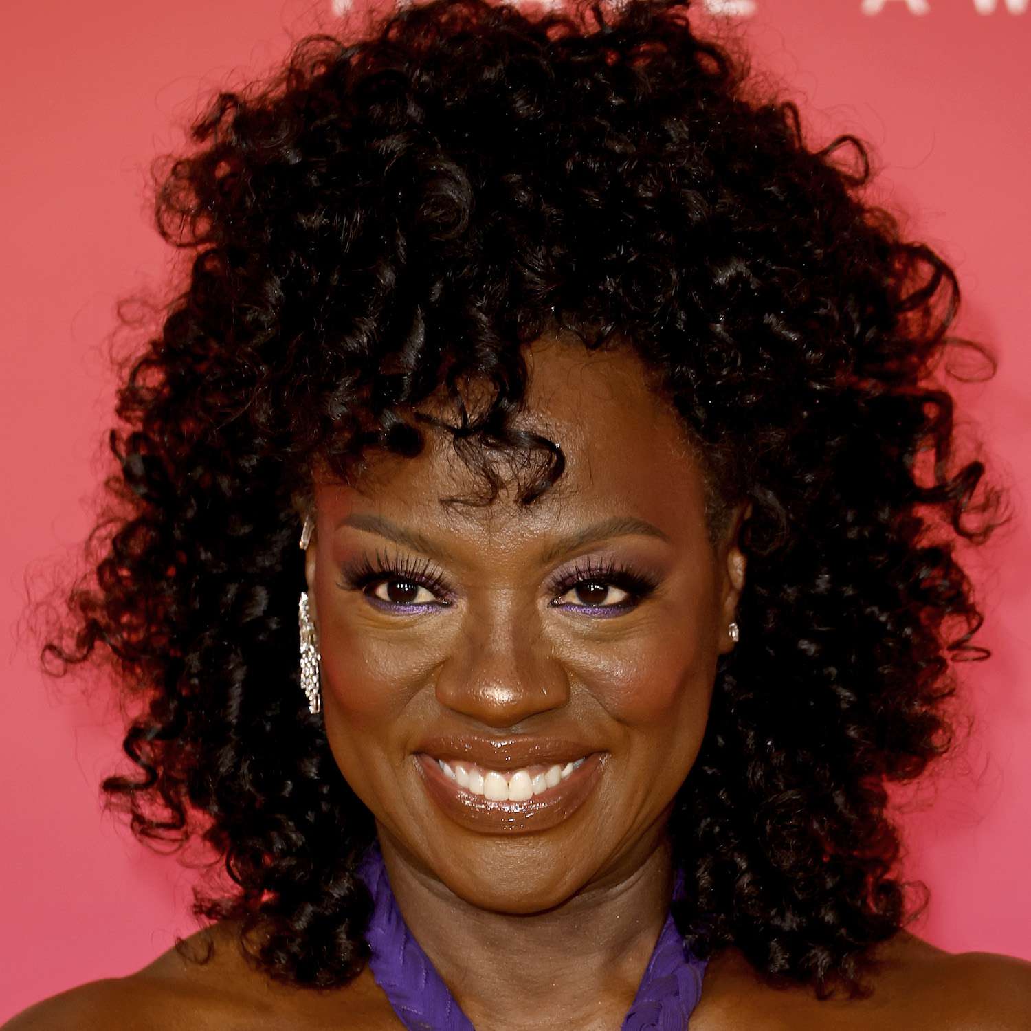 Viola Davis wears a curly half-up hairstyle with face-framing layers