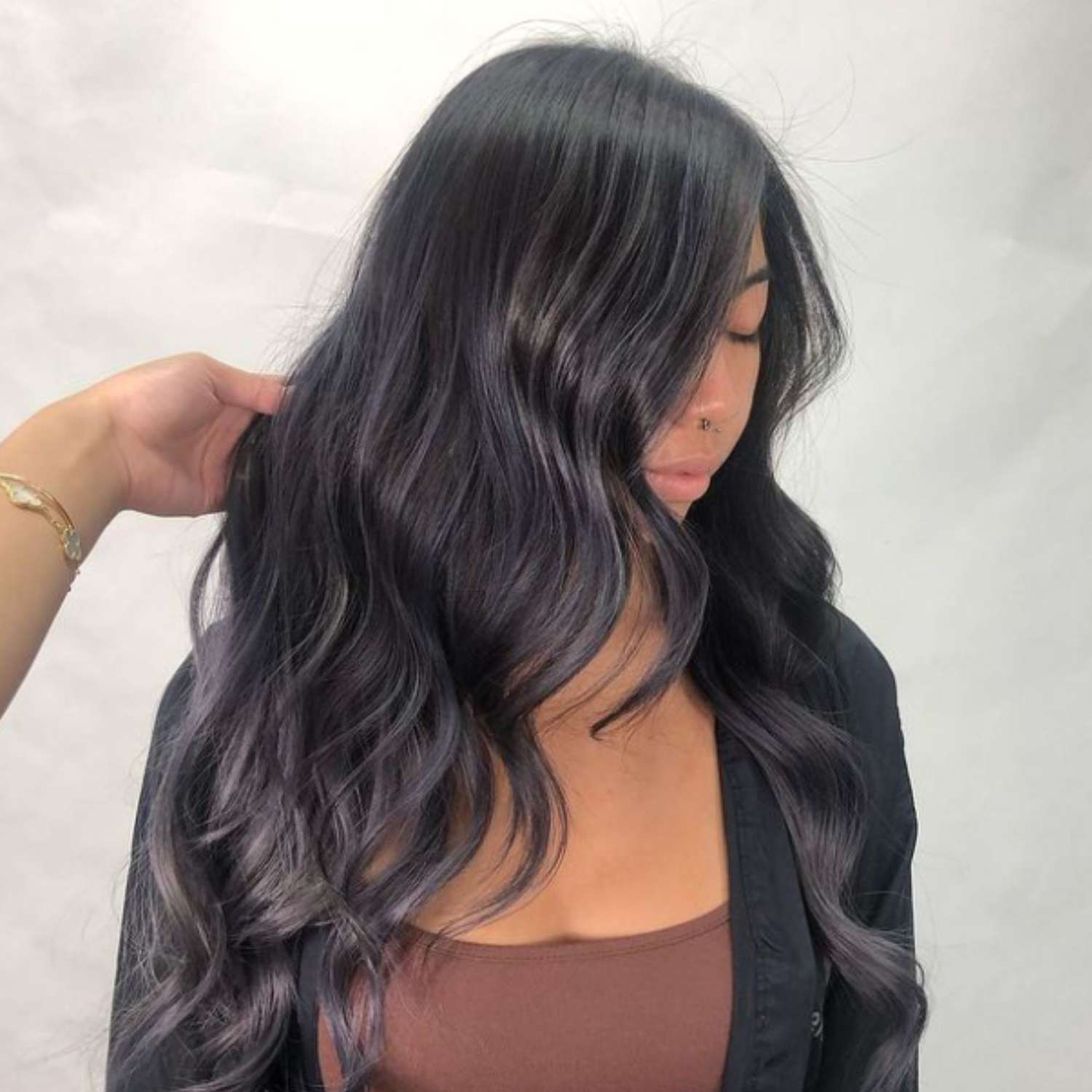 Almost-gray blue-black hair in loose waves, viewed from a slight angle
