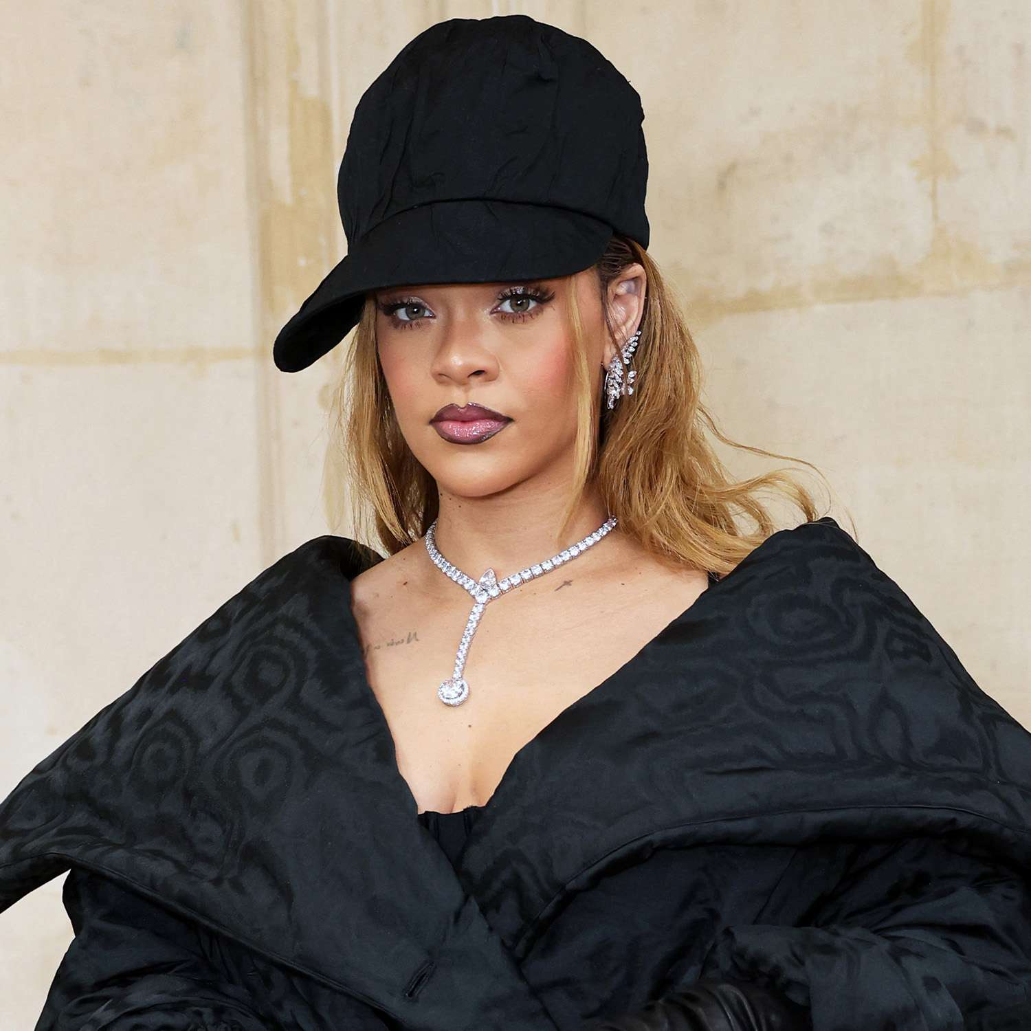 Rihanna at the Dior Haute Couture show with goth ombre lined lips and honey blonde hair