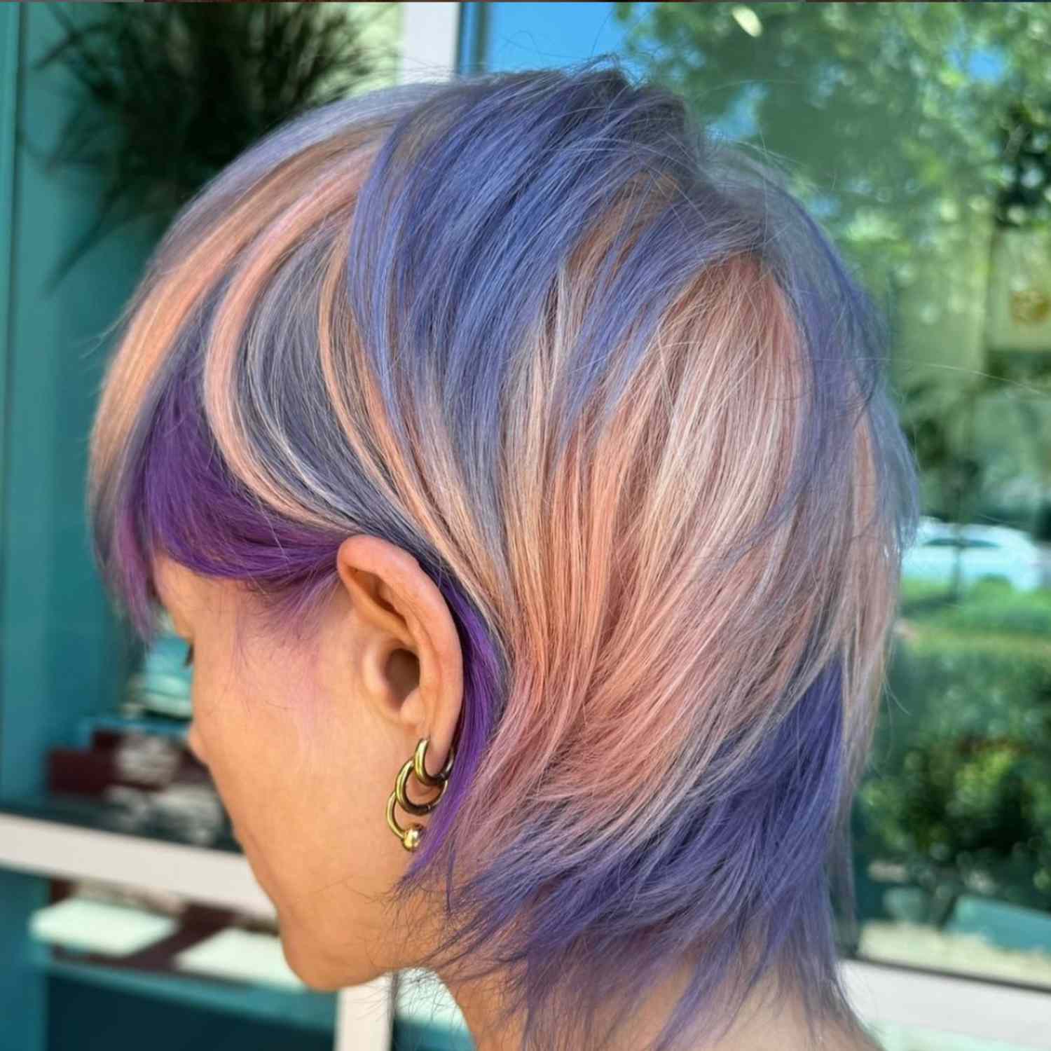 Pastel-sherbert colored hair.