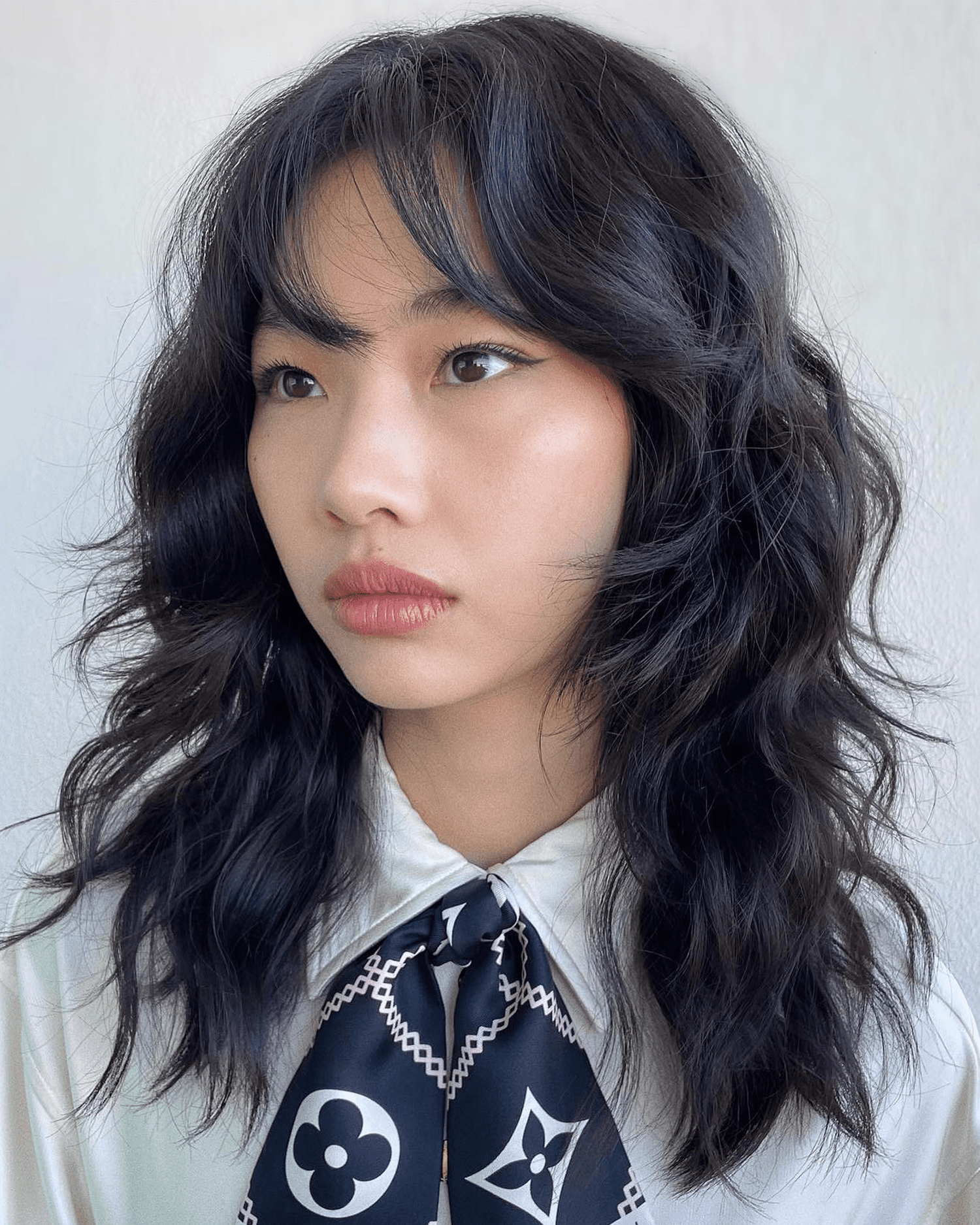 Actress Hoyeon with a wolf cut shaggy hair cut